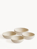 Set of four textured ceramic bowls on a white background