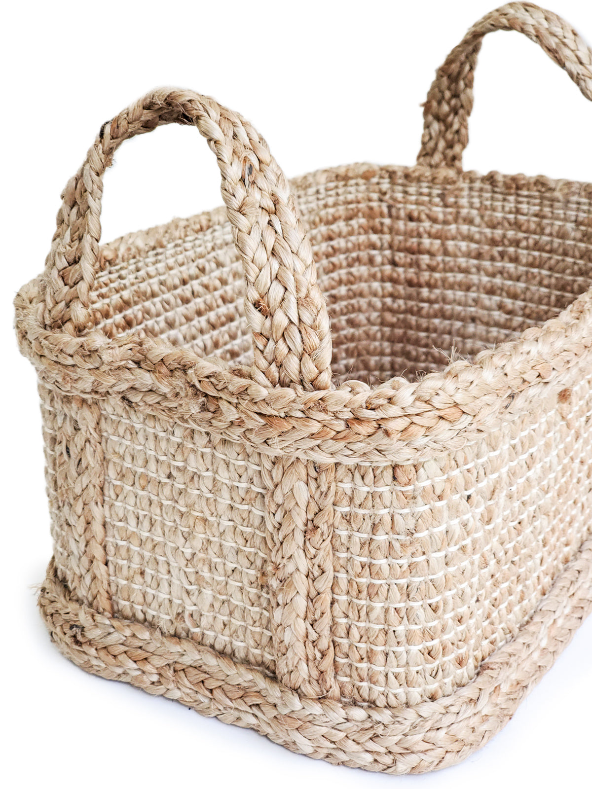 Woven basket with handles on a white background