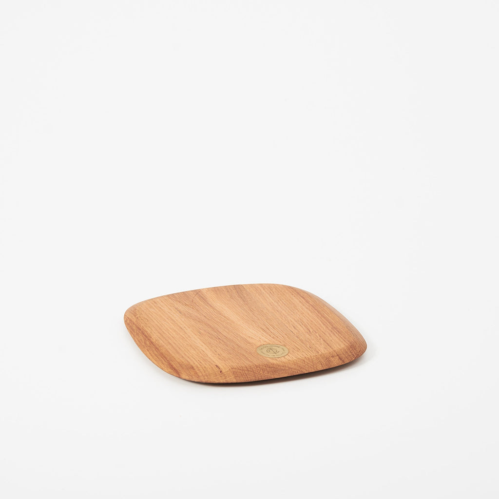 Wooden cutting board on a white background
