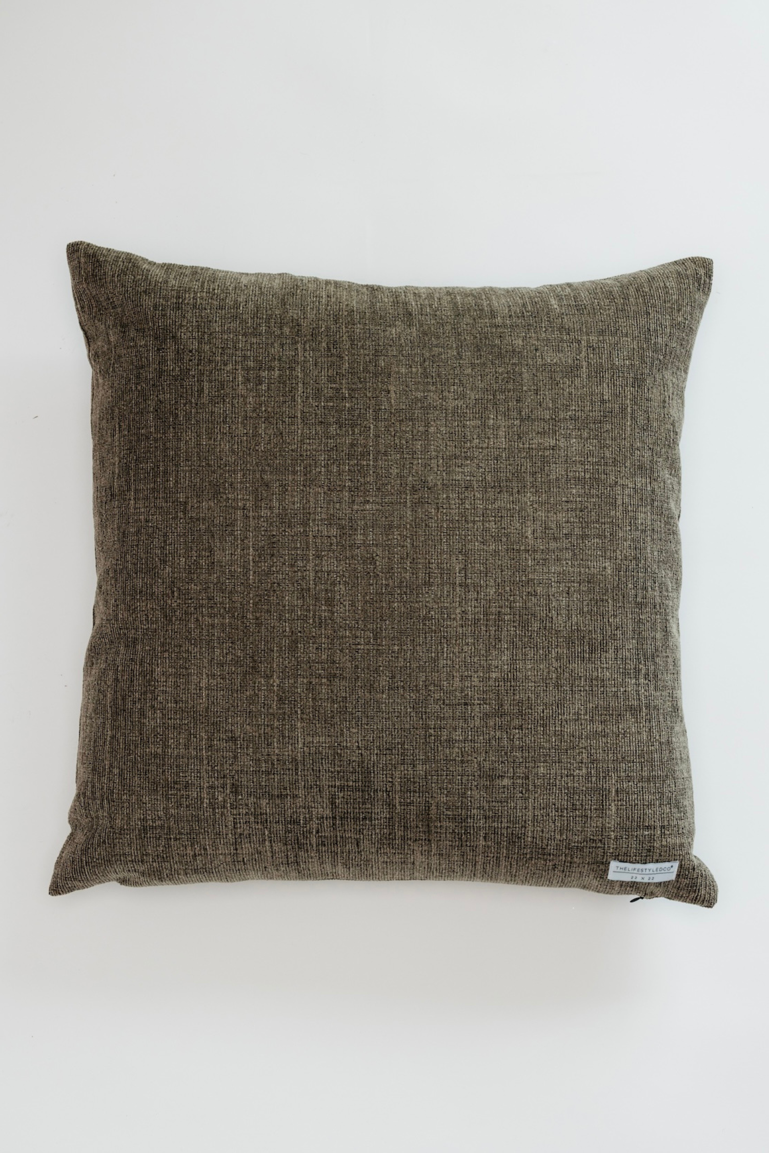 Textured brown pillow on a white background