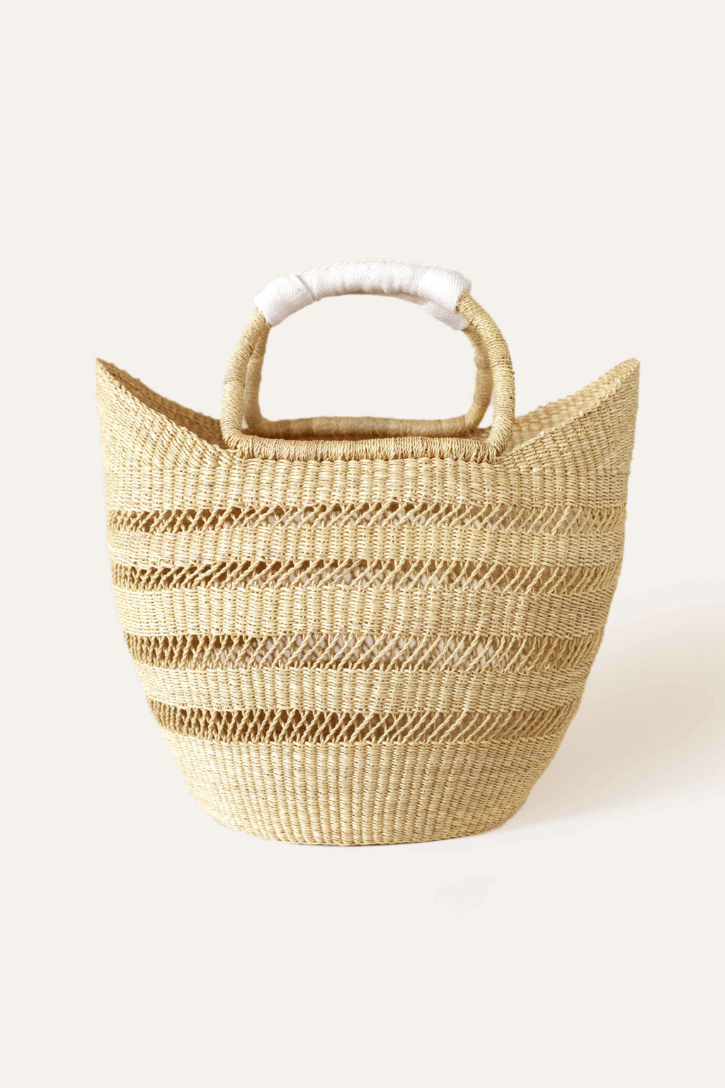 Woven basket with striped pattern on a white background
