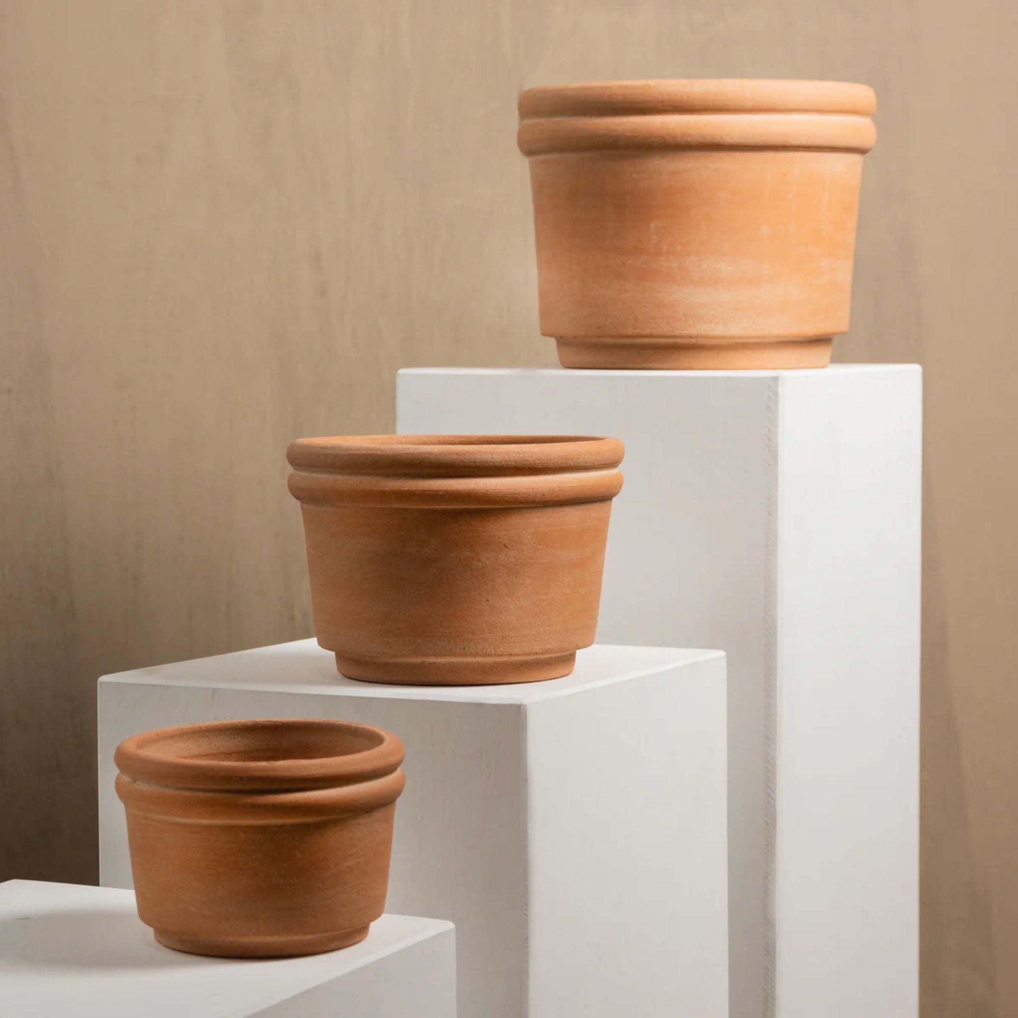 Handmade terracotta planter crafted by artisans in Honduras with a warm natural clay finish, ideal for indoor plants, herbs, succulents, and modern organic home décor.