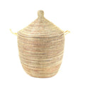 Woven basket with a lid on a white background