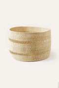 Woven basket with natural fibers on a white background
