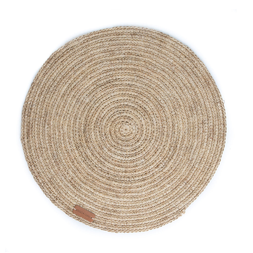 Round woven mat with a natural fiber texture on a white background