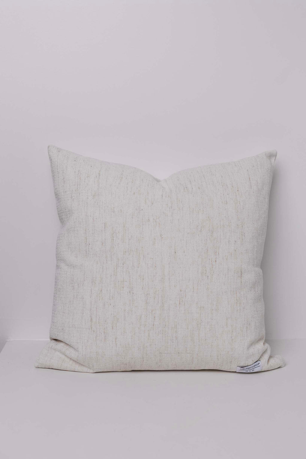 Textured pillow on a light gray background