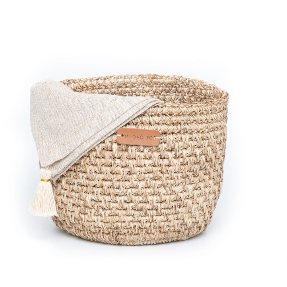 Handwoven natural bread basket made by artisans with woven natural fibers. Decorative serving basket for bread, pastries, fruit, countertop storage, and farmhouse or modern organic kitchen décor.