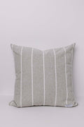 Striped gray pillow on a light gray background