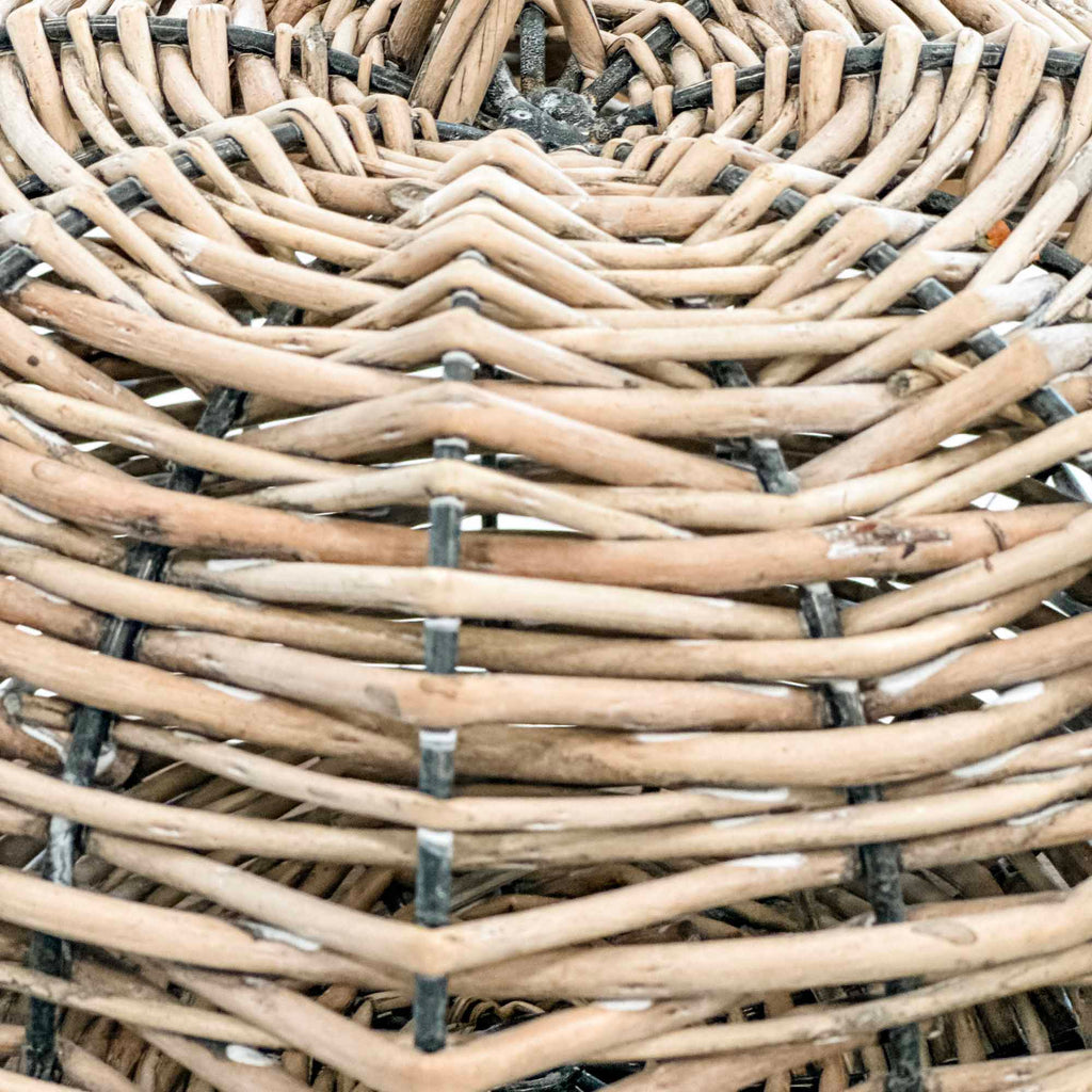 Close-up of a woven basket with natural wood texture