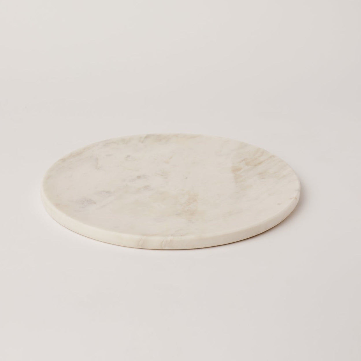 Round marble coaster on a light gray background