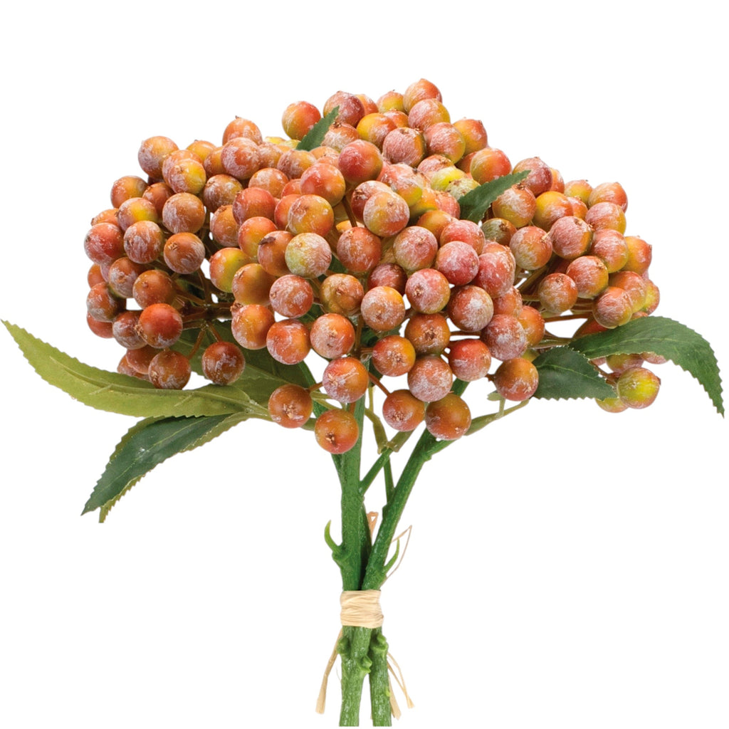 Bouquet of artificial berries with green leaves on a white background