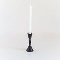 Minimal black iron taper candle holder styled in a neutral timeless interior with European-inspired decor | Sorelle Rossi Shoppe
