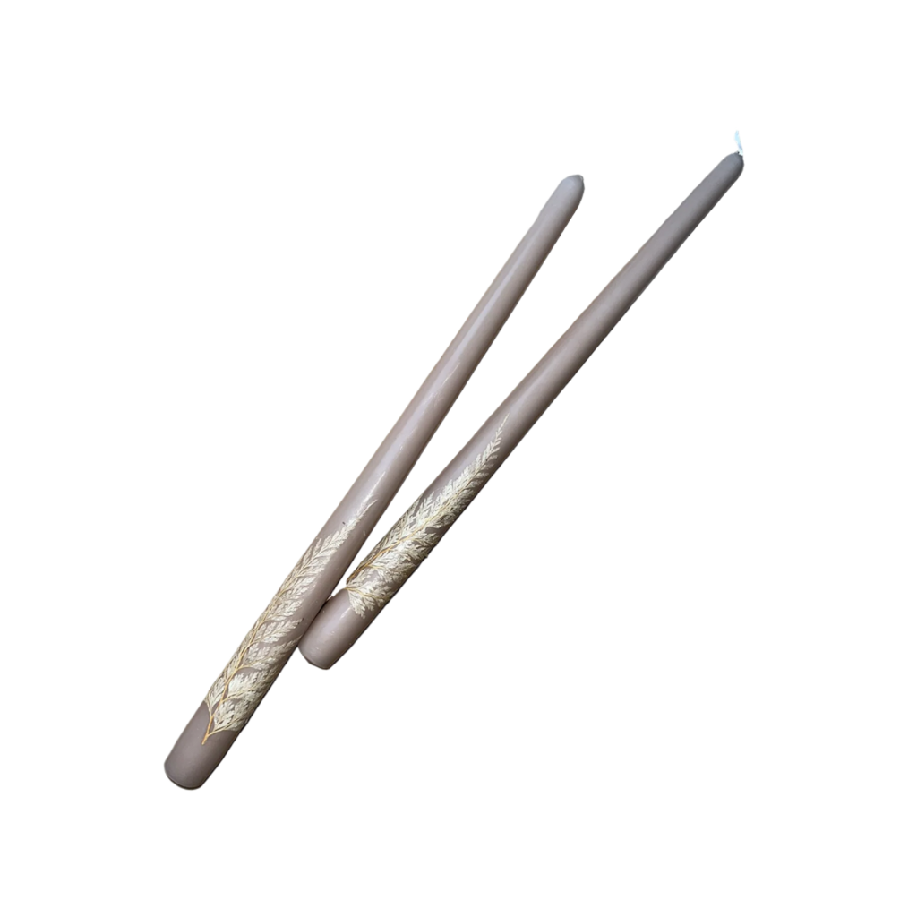 Pair of drumsticks with beige and brown patterned handles on a white background
