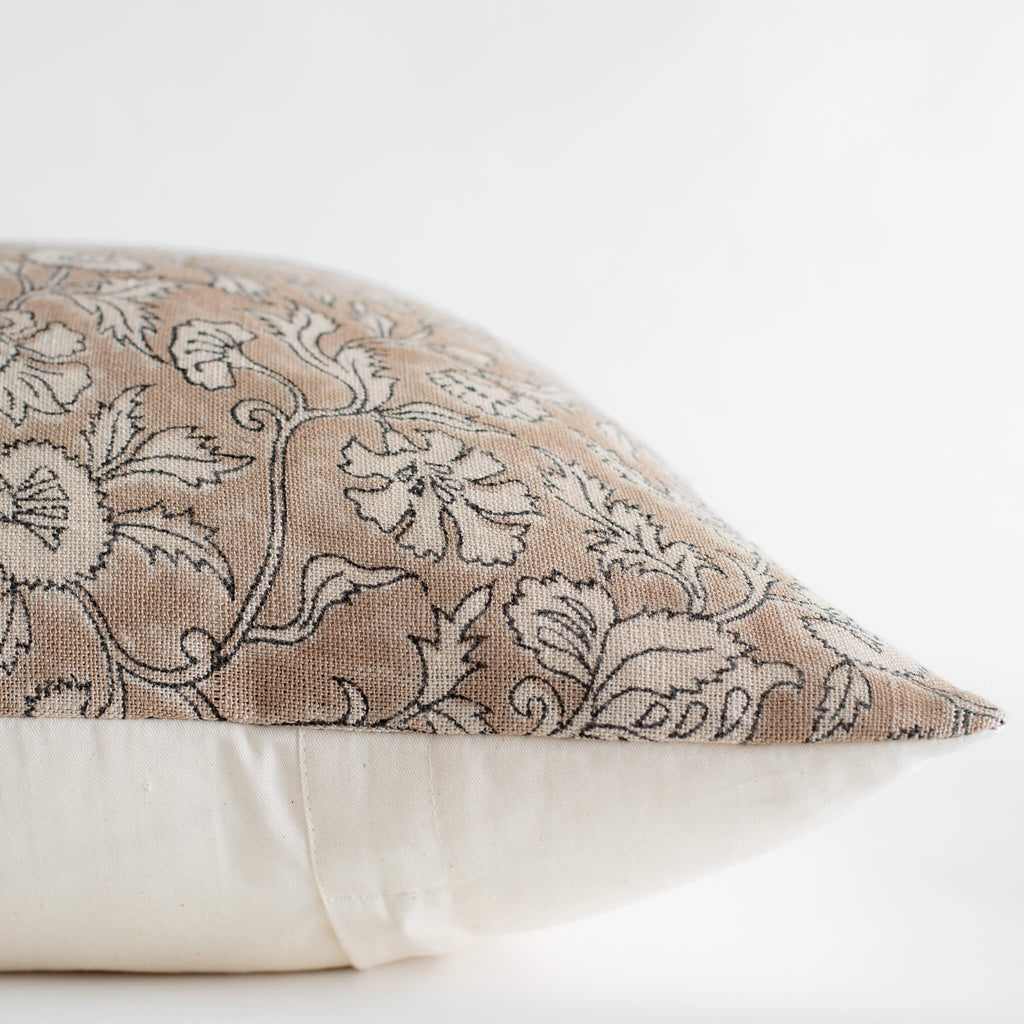 Decorative pillow with floral pattern on a white background