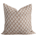 Decorative pillow with a beige and white pattern on a beige background