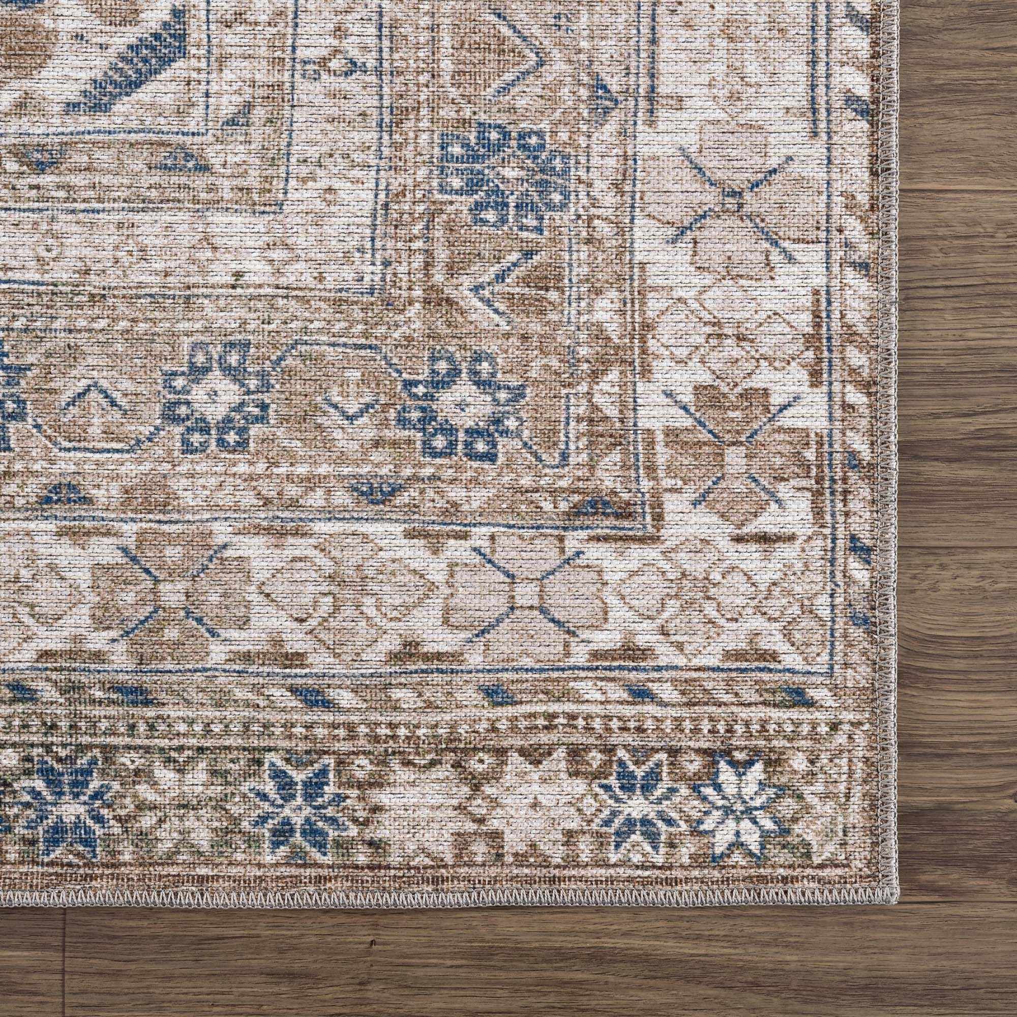 Patterned rug on a wooden floor