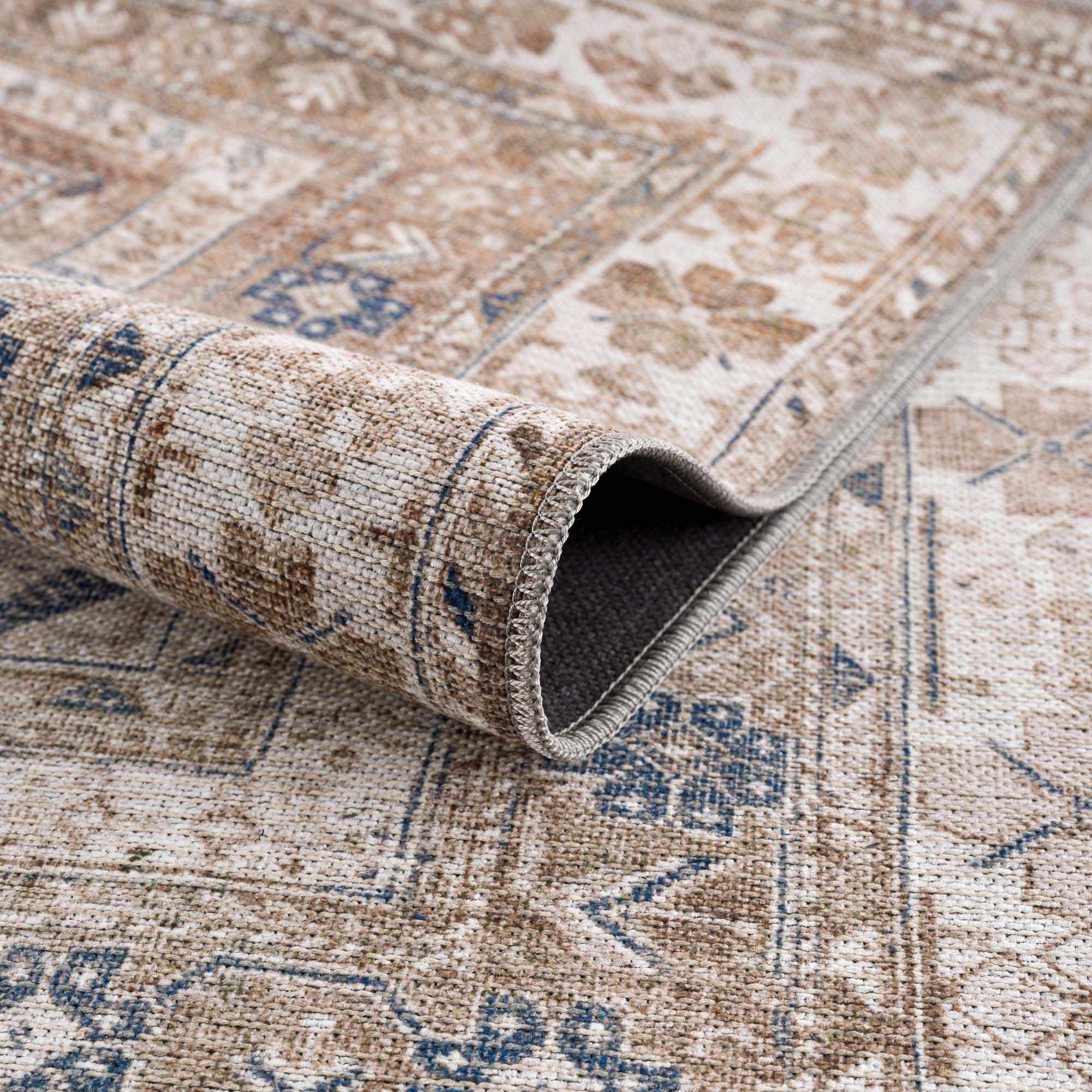 Roll of patterned rug with geometric design