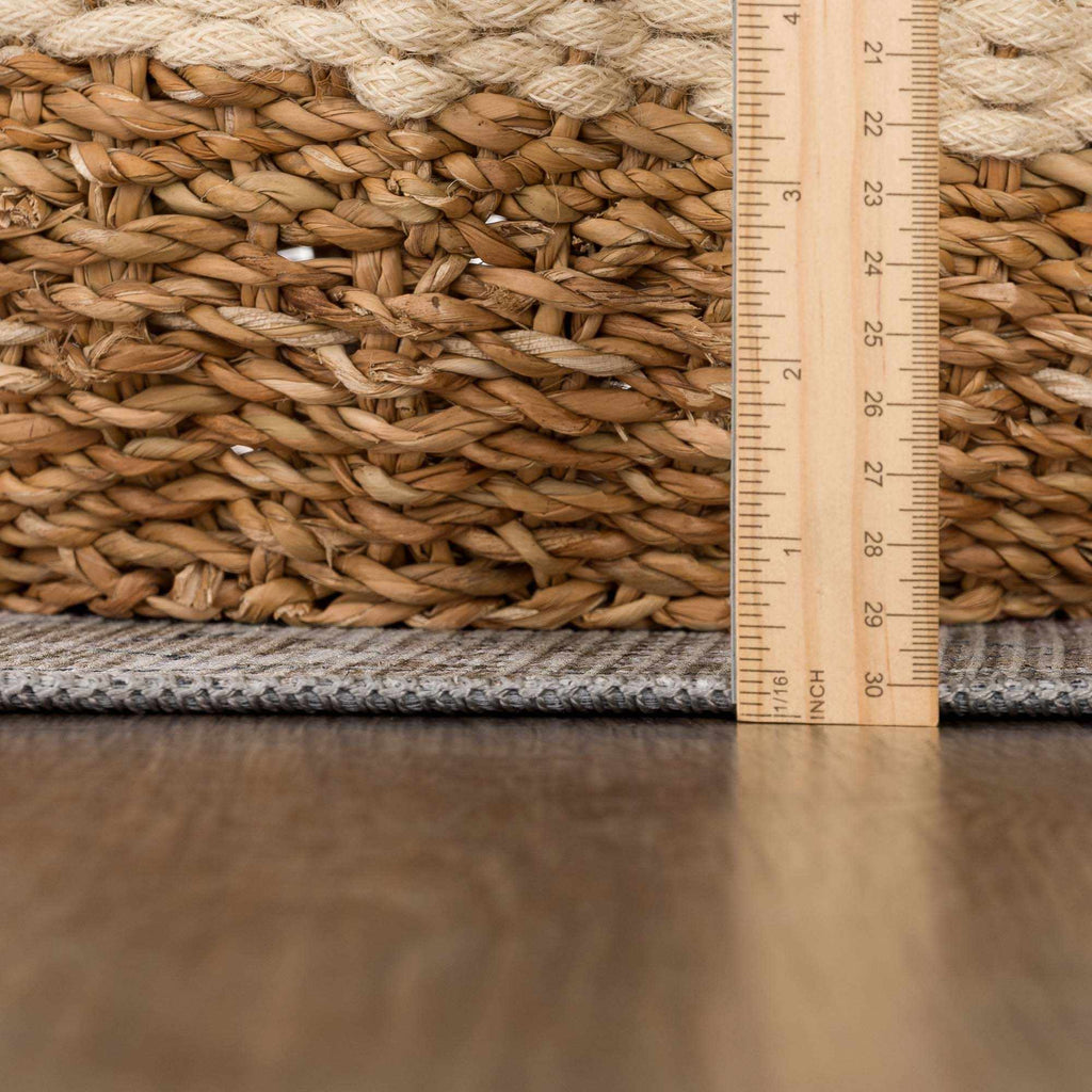 Woven basket with a ruler for scale on a wooden surface