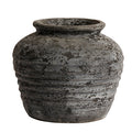Textured gray pot on a white background