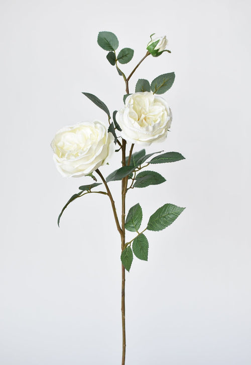 Artificial flower stem with white roses on a light gray background