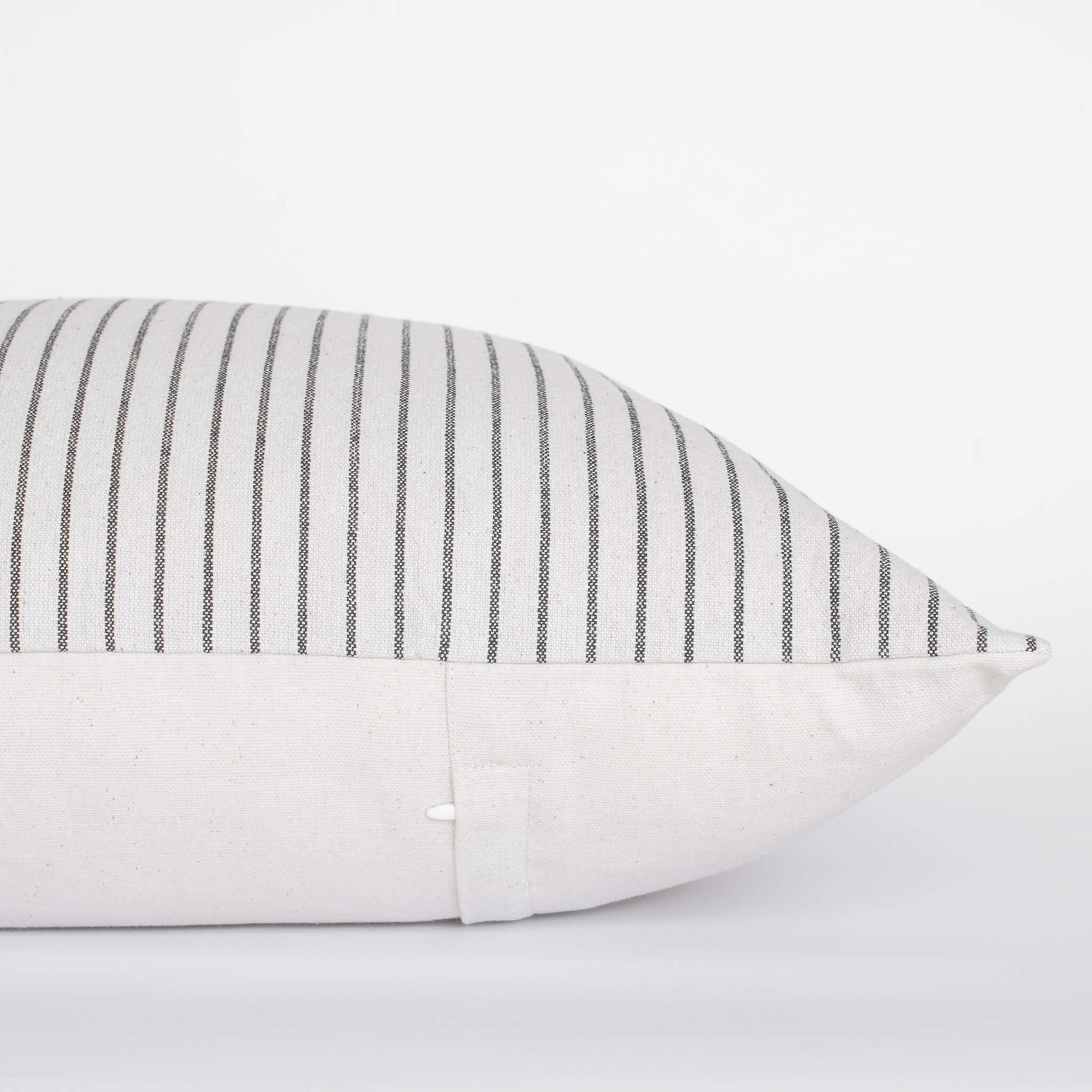 Striped pillowcase with black and white stripes on a light gray background