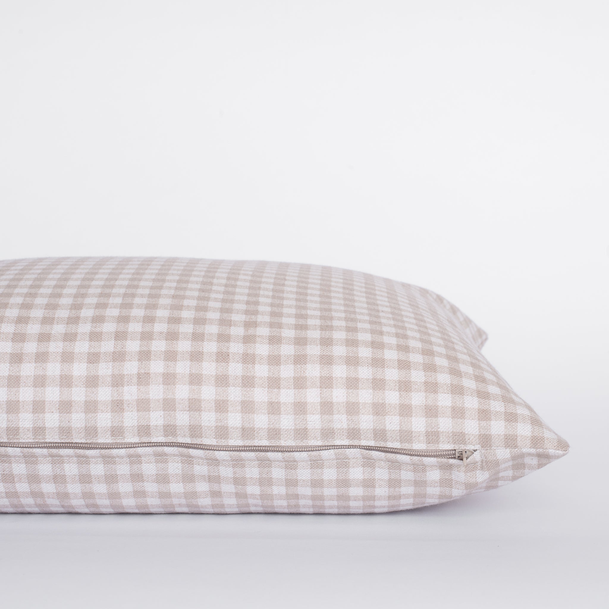 Checkered pillow on a light gray background