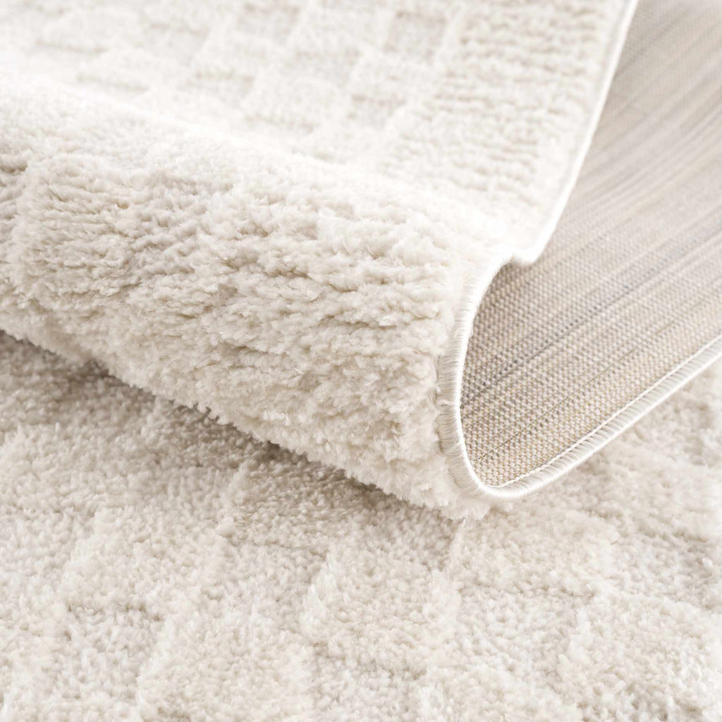 Close-up of a beige textured fabric surface