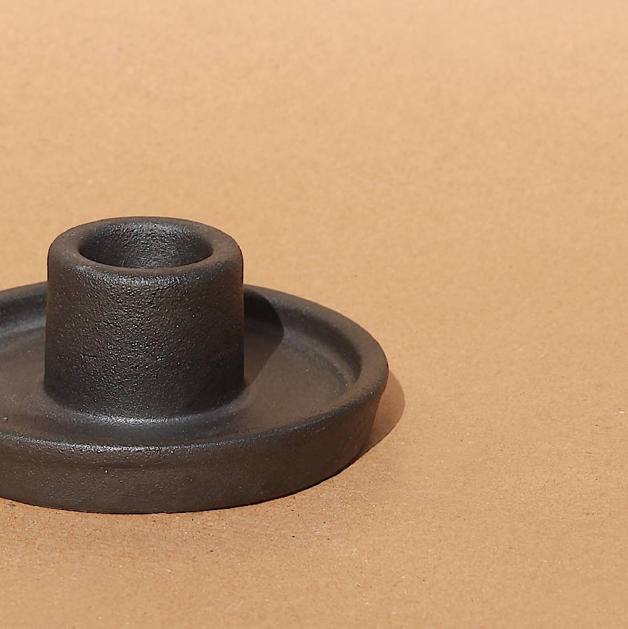 Handcrafted matte black ceramic candle holder with sculptural minimalist silhouette and modern organic styling on a warm neutral background | Sorelle Rossi Shoppe