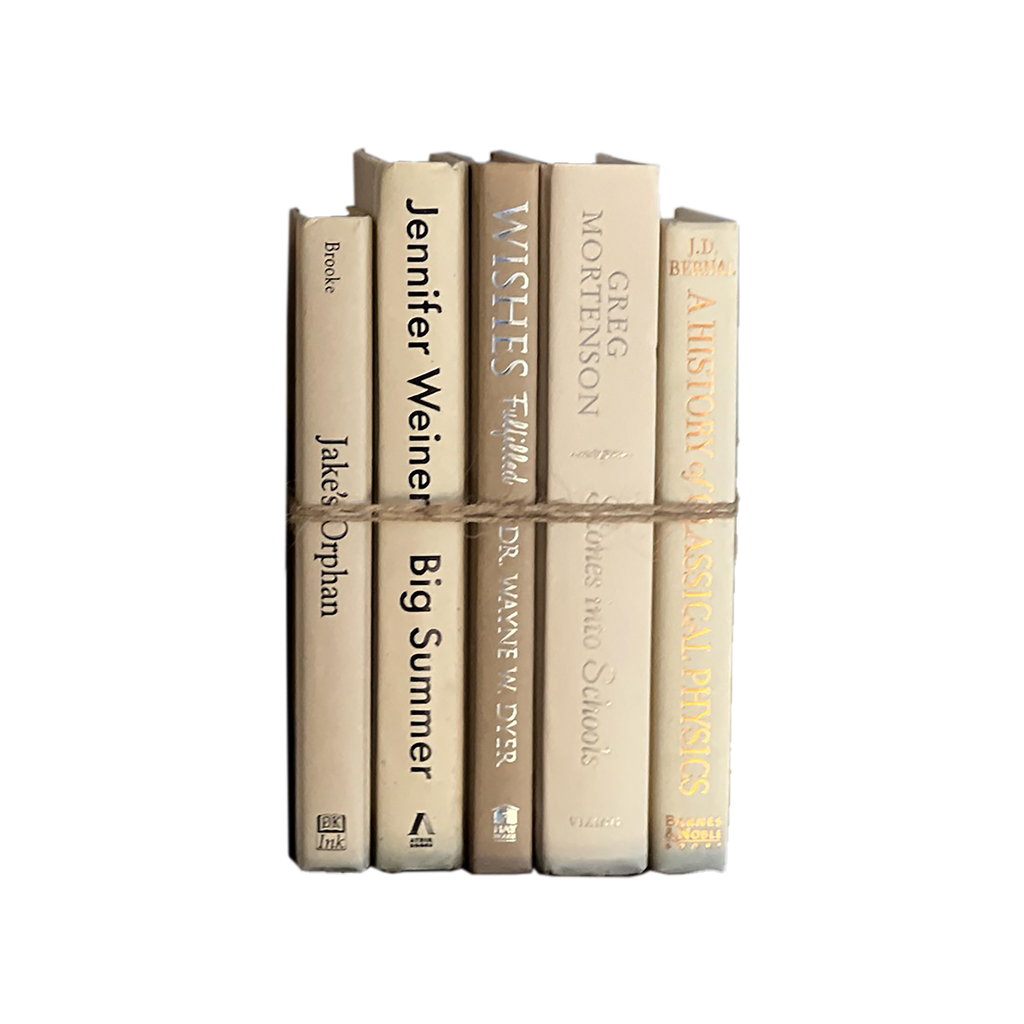 Stack of books tied together with a white background