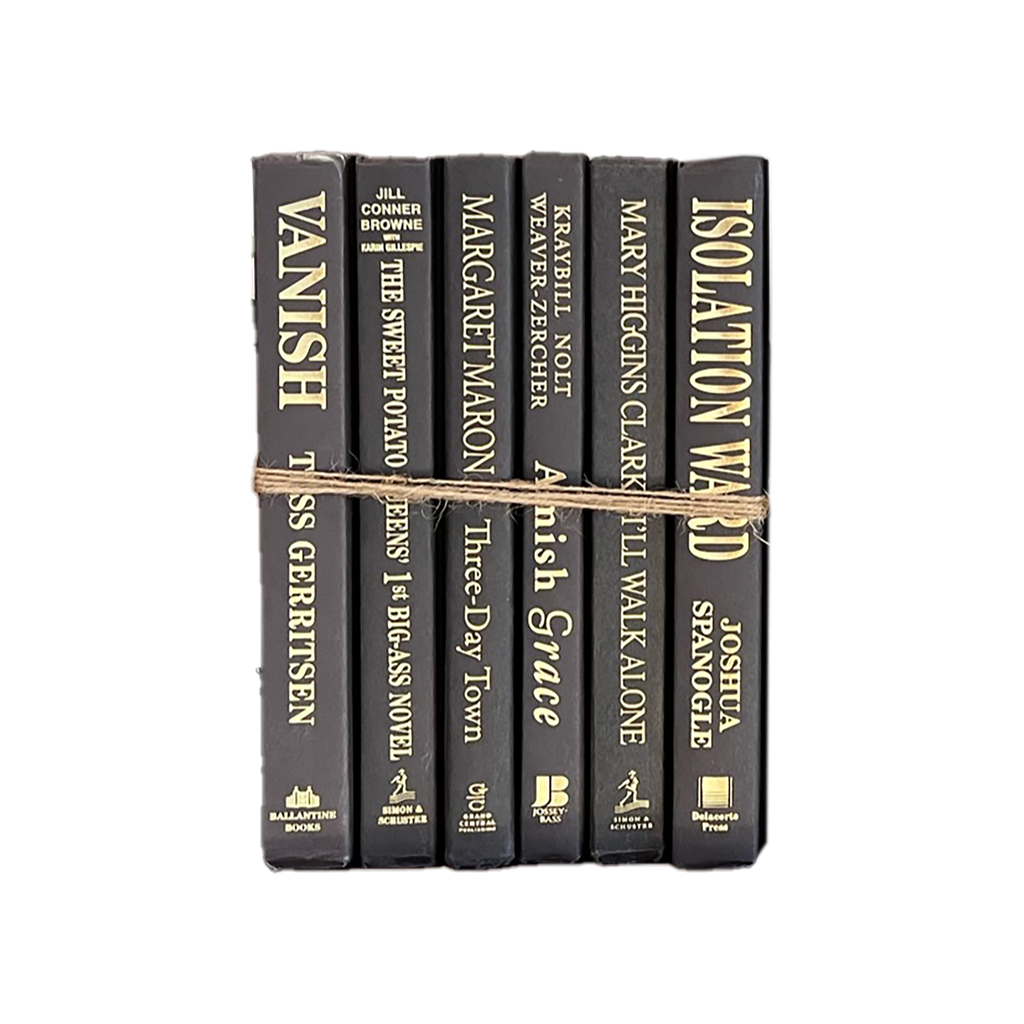 Stack of books bound together with twine on a white background