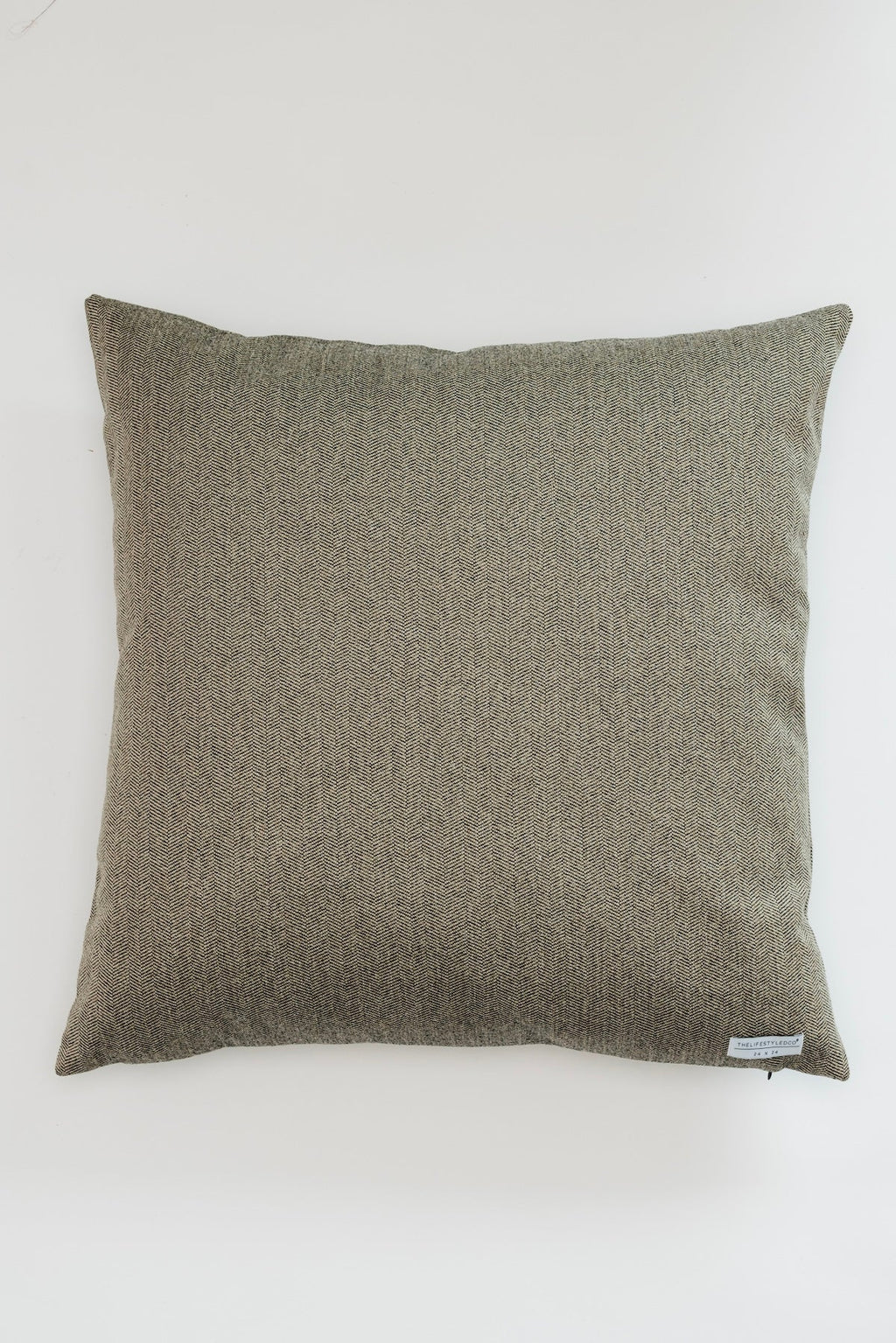 Brown textured pillow on a white background