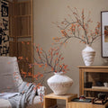 Decorative vases with branches in a living room setting