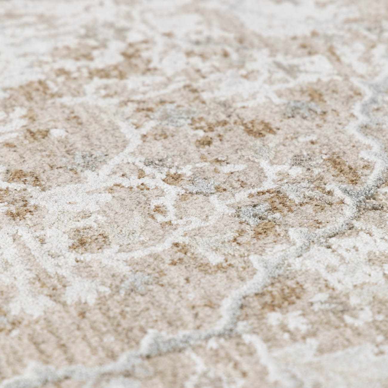 Close-up of a textured beige and brown surface with a subtle pattern