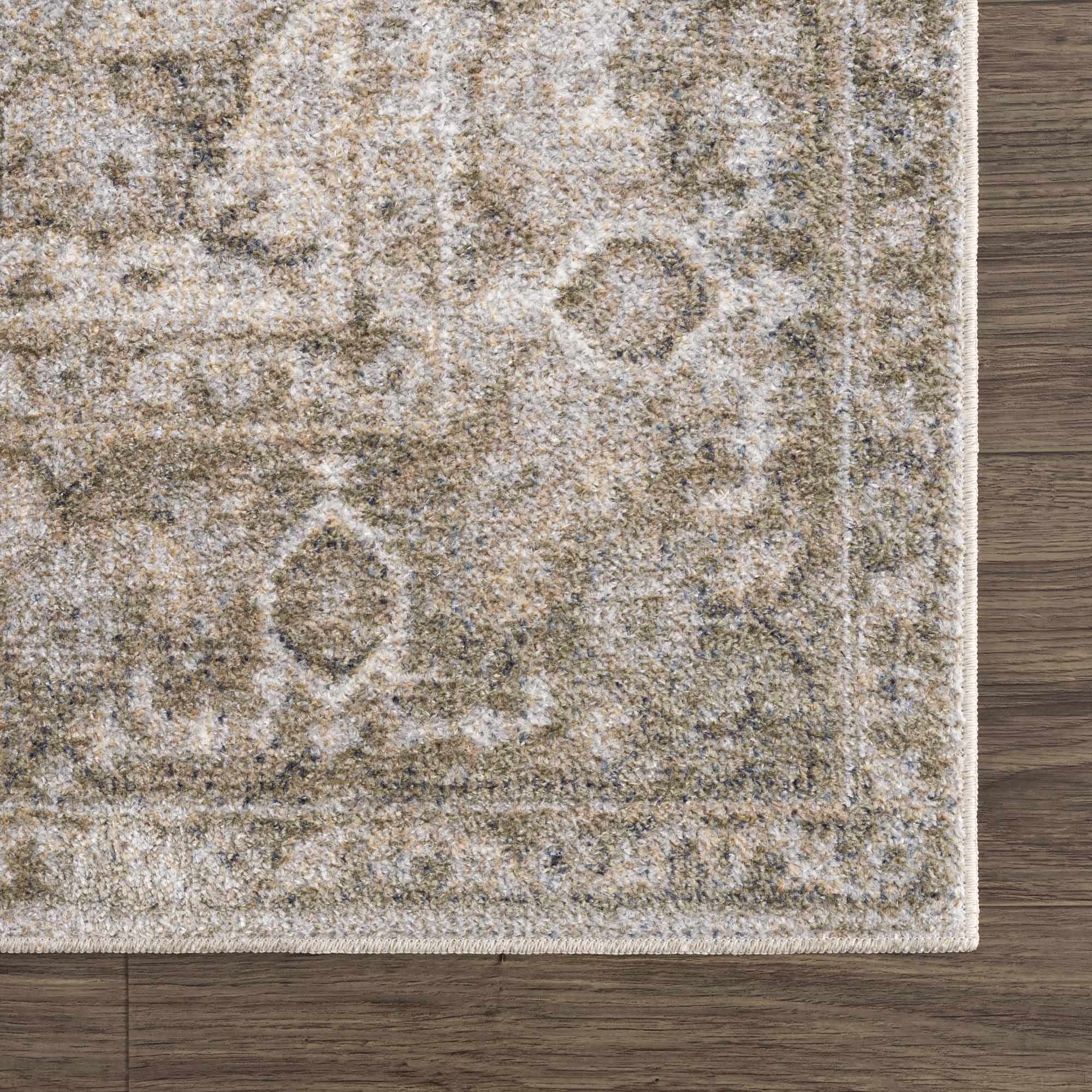 Close-up of a patterned rug on a wooden floor