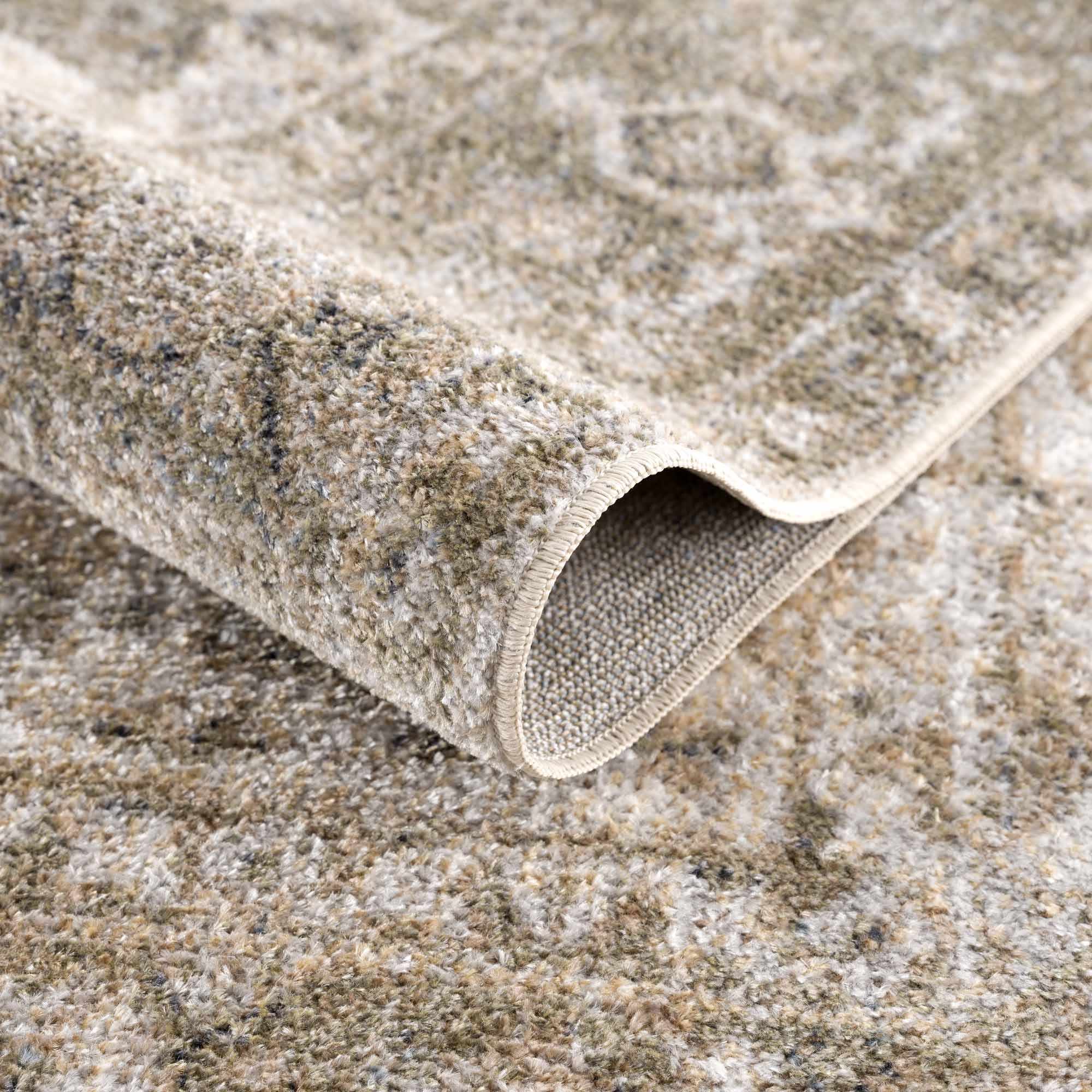 Close-up of a beige textured rug with a subtle pattern on a matching surface.