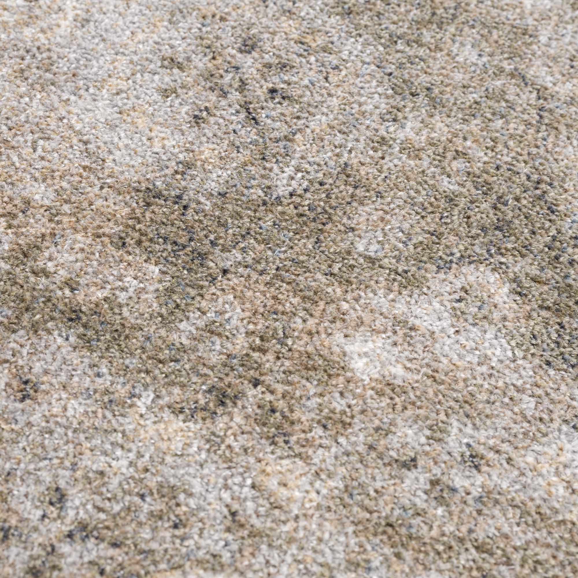 Close-up of sand with a brown and beige color.