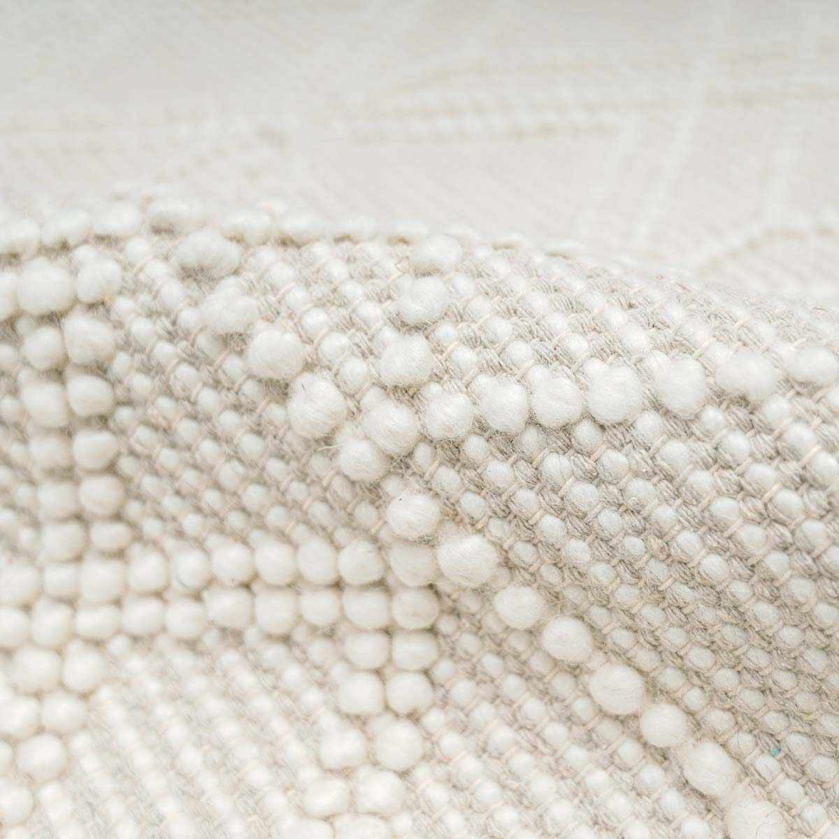 Close-up of textured fabric with white and beige colors