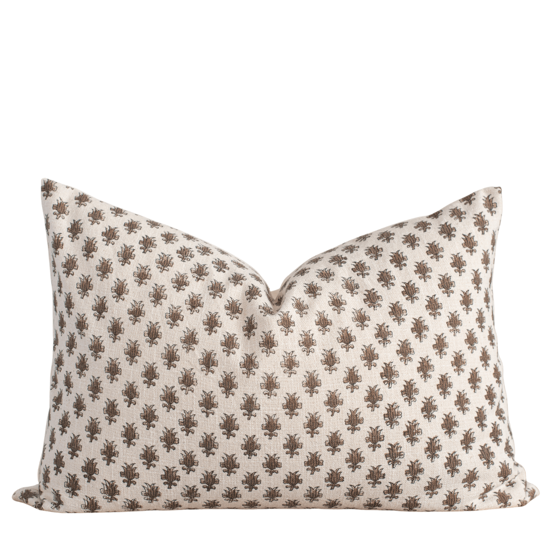 Decorative pillow with a subtle pattern on a white background