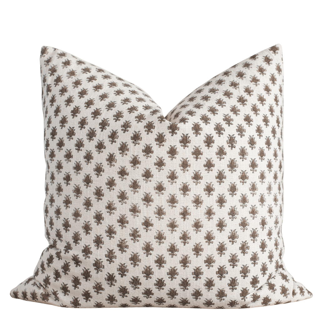 Decorative pillow with a brown pattern on a white background