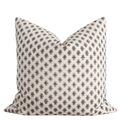 Decorative pillow with a brown pattern on a white background
