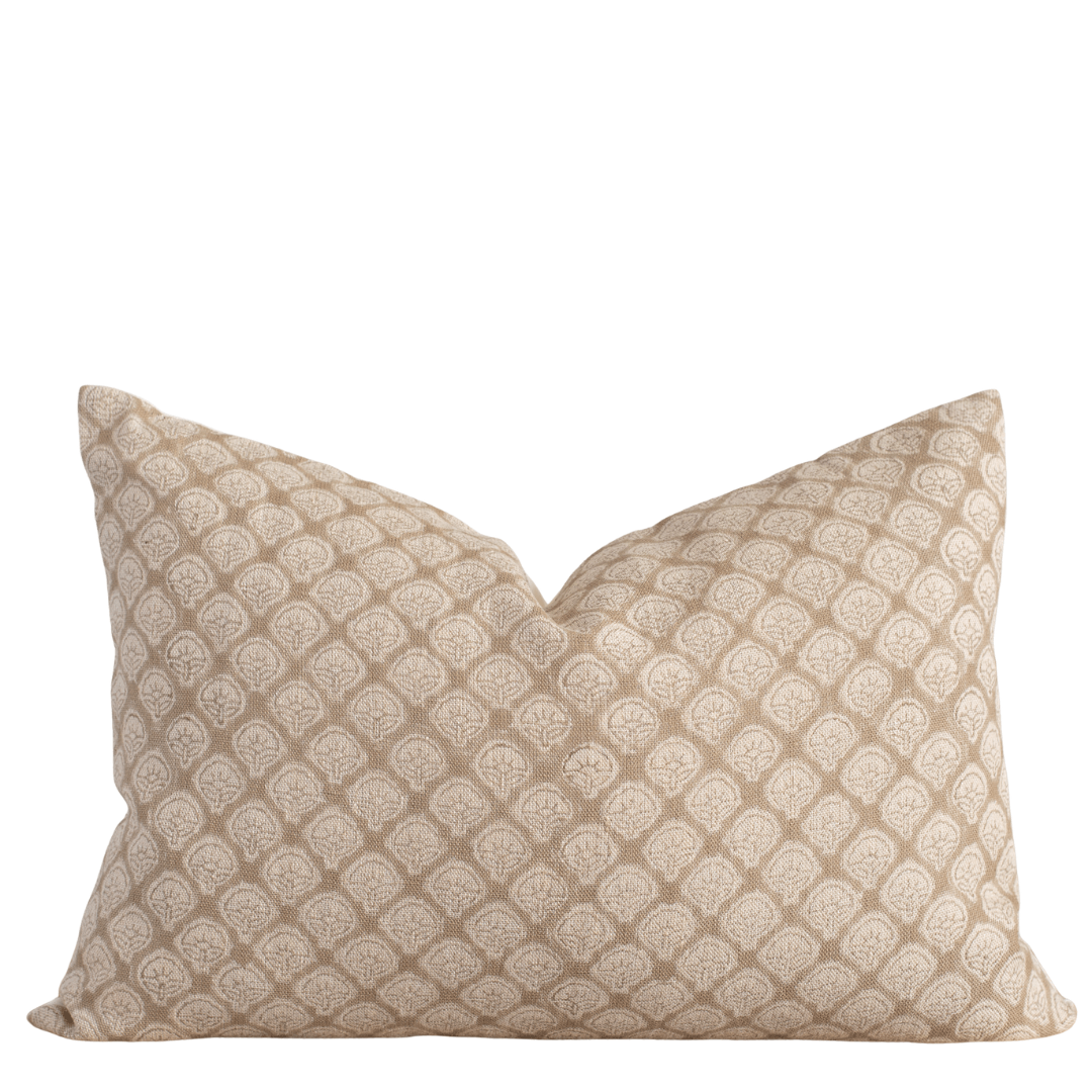 tan and white lumbar pillow