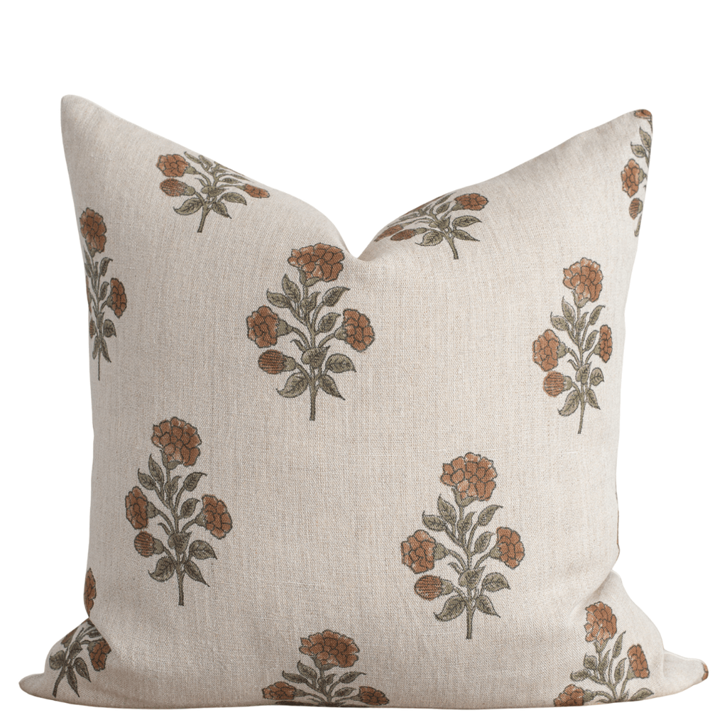 Decorative pillow with floral pattern on a beige background