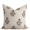 Decorative pillow with floral pattern on a beige background