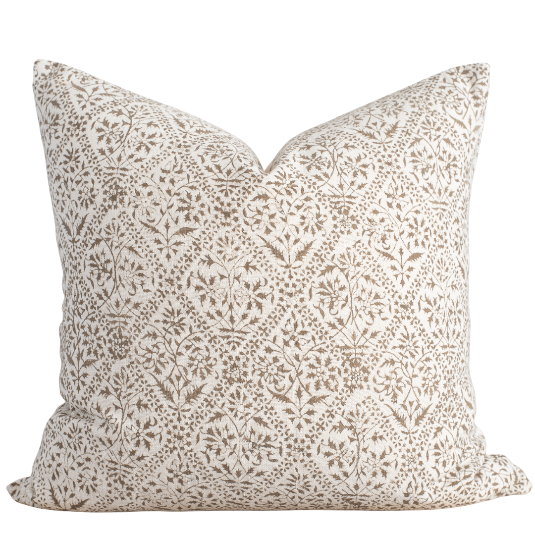 Decorative pillow with floral pattern on a white background