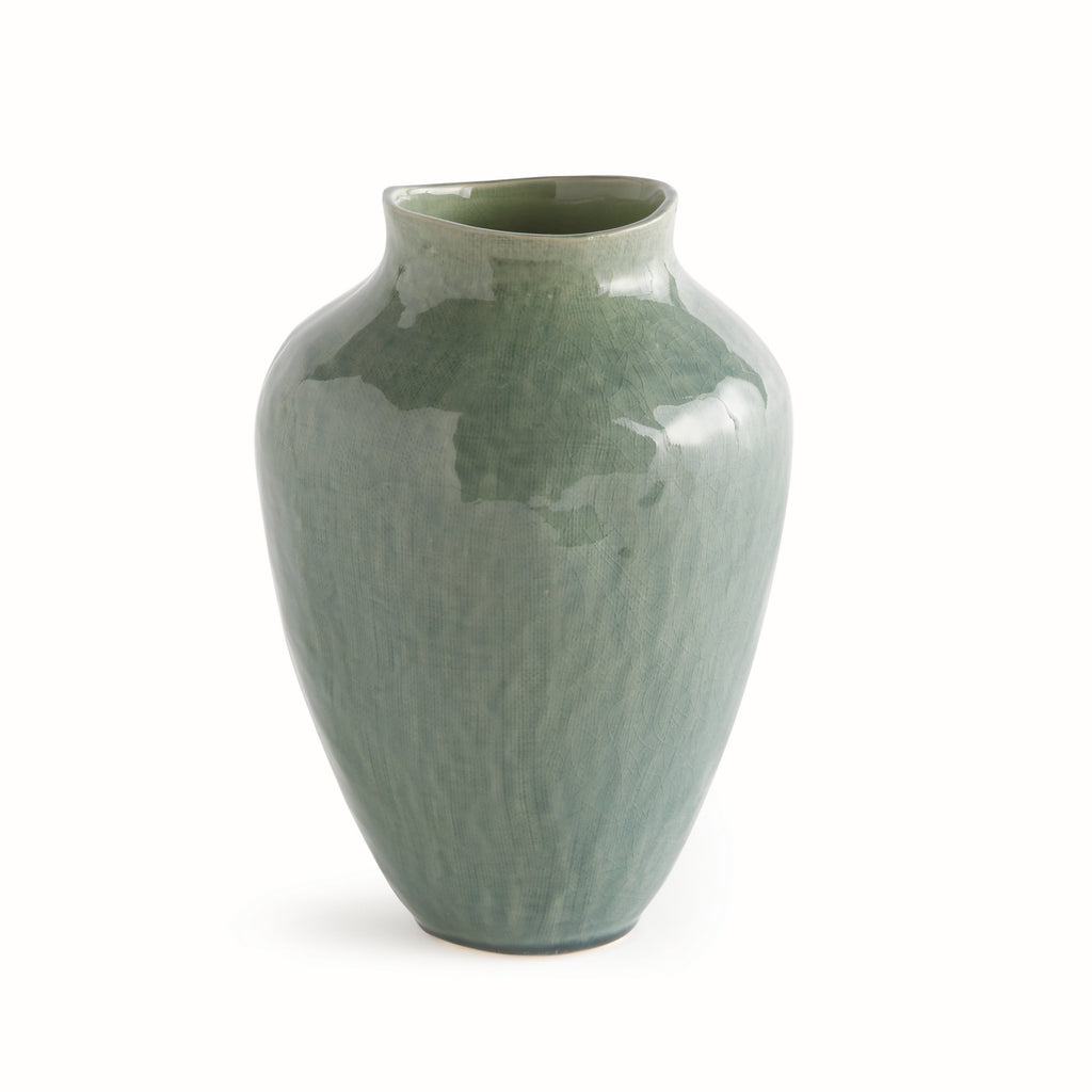 Green ceramic vase on a white background