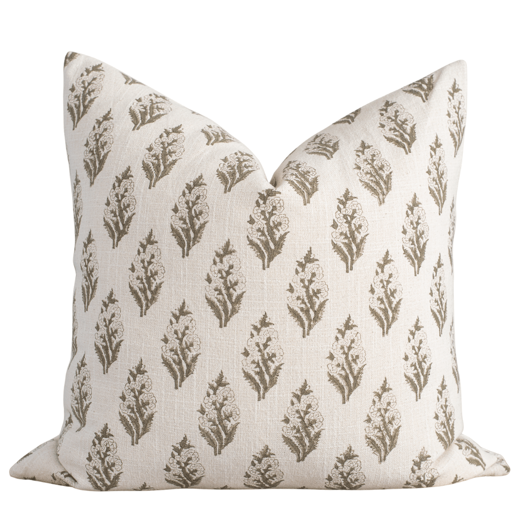 Decorative pillow with a floral pattern on a white background