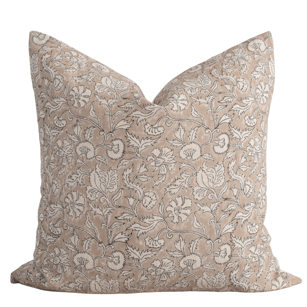 Decorative pillow with floral pattern on a beige background