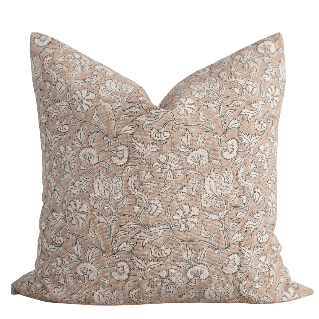 Decorative pillow with floral pattern on a beige background