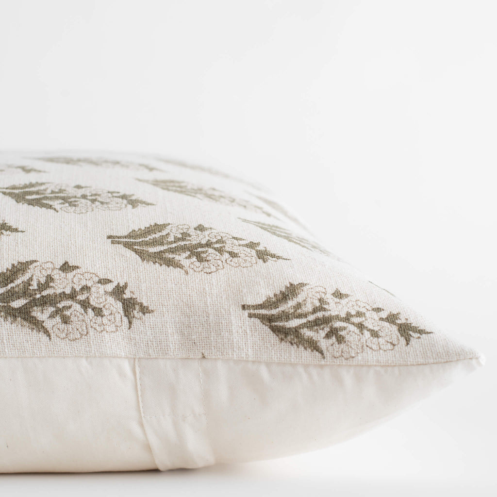 Decorative pillow with leaf pattern on a white background
