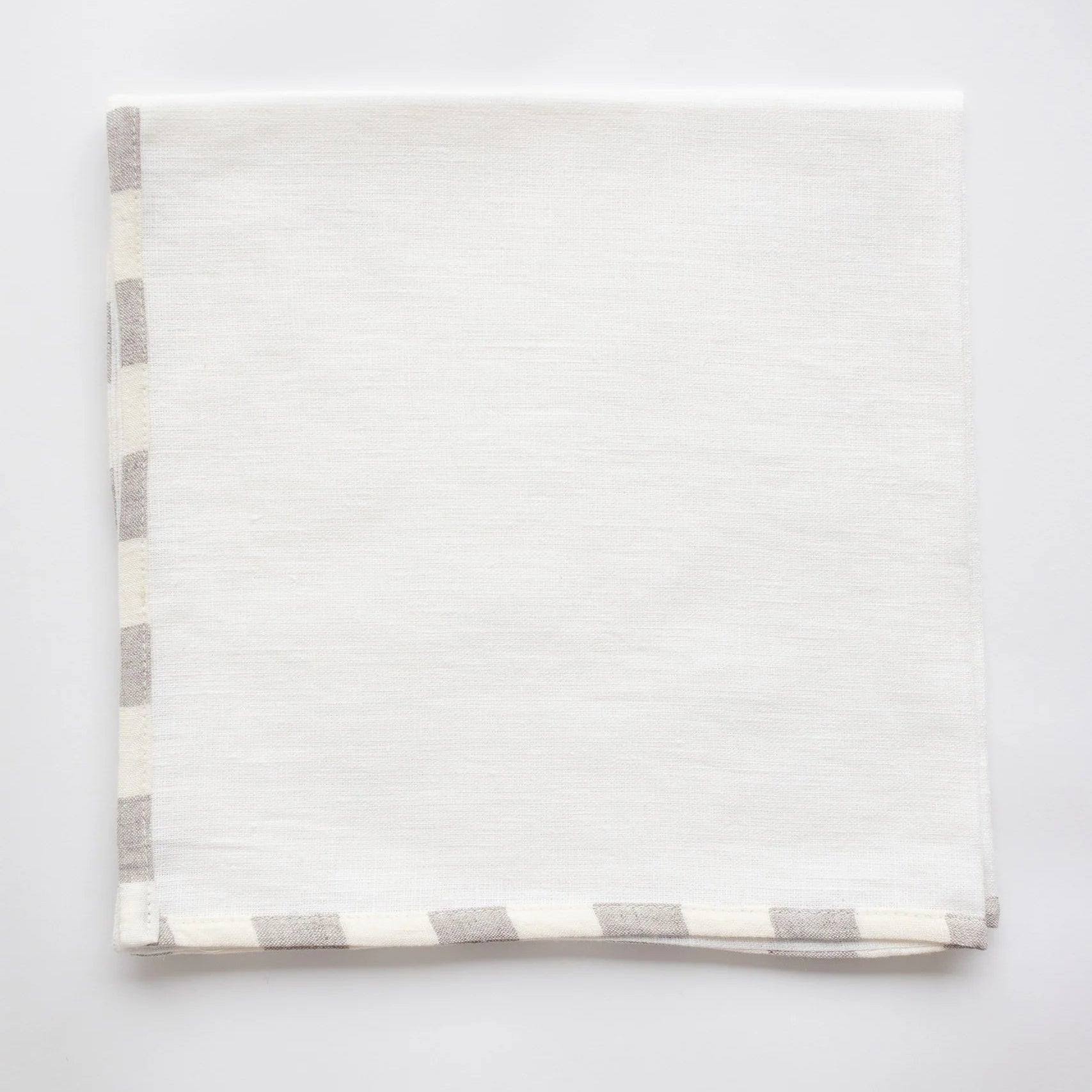 Soft neutral linen tea towel with subtle woven stripe detailing and timeless European-inspired kitchen styling | Sorelle Rossi Shoppe